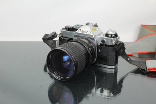 Canon AE - 1 Program + Tokina AT - X 28 - 85mm Canon FD mount lens - Dutch|Thrift